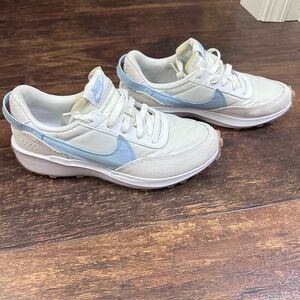 Nike White Sneakers with Light Blue Swoosh Accents